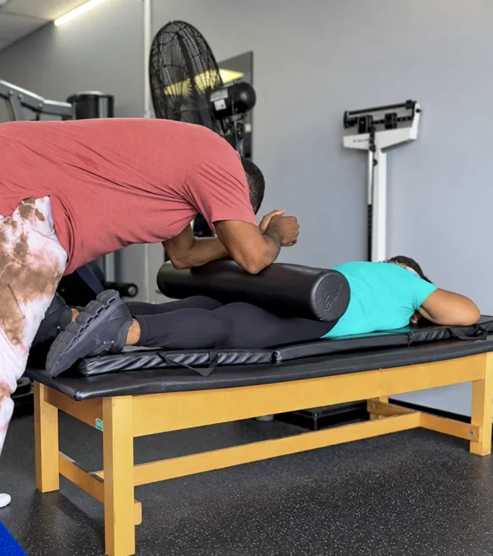Coach Cal guiding a client through foam-roller work